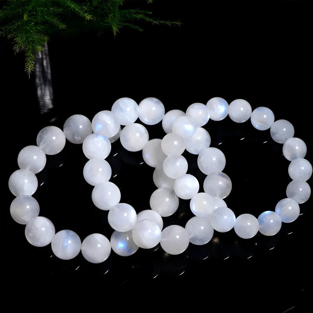 Natural blue moonlight round bead moonstone bracelet in white colour showing polished geometry-shaped beads