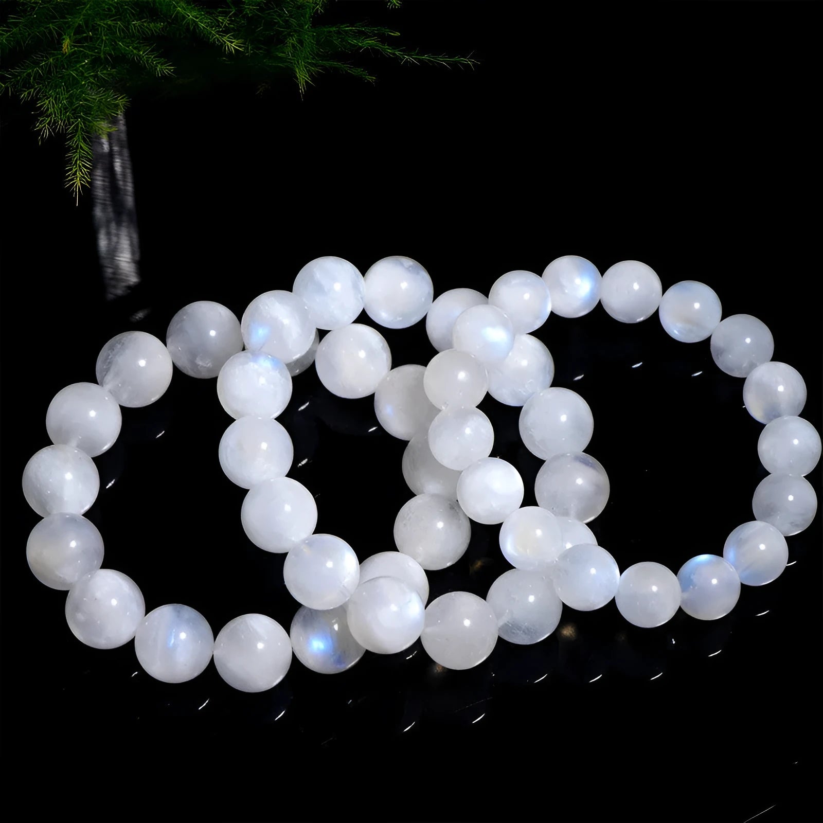 Natural blue moonlight round bead moonstone bracelet in white colour showing polished geometry-shaped beads