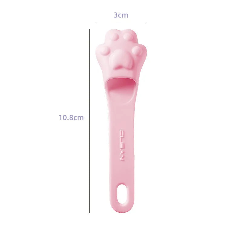 Pink silicone finger toothbrush for dogs and cats with soft nubby bristles.