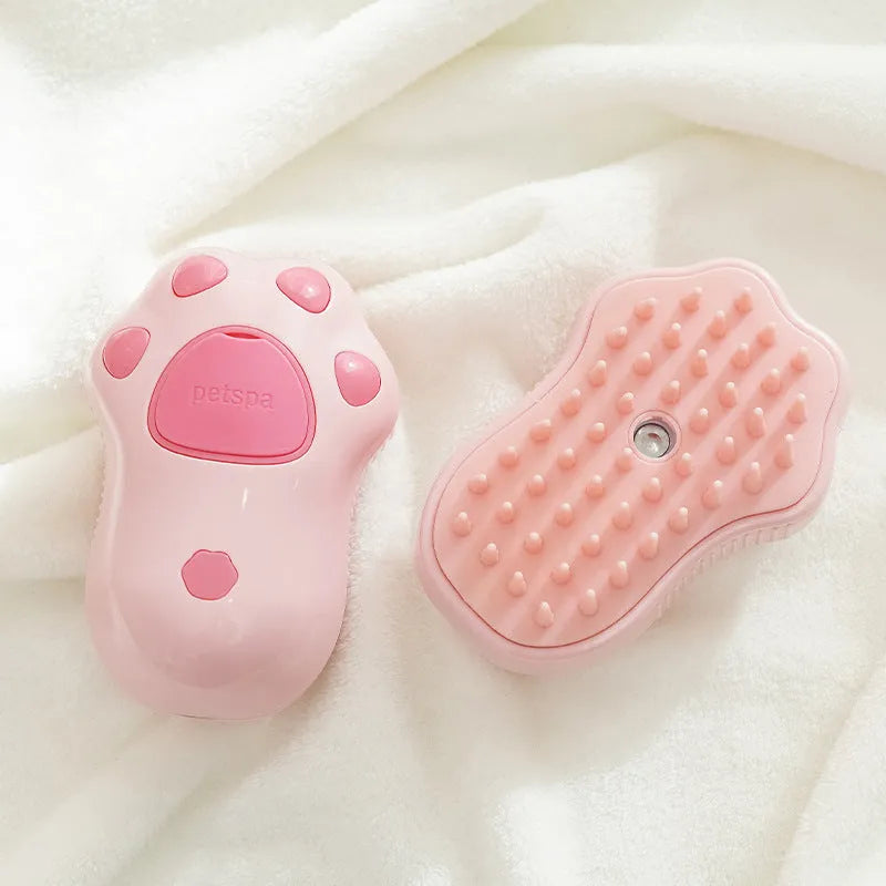 Cat paw style USB rechargeable pet spray massage brush on white background, compact ABS plastic grooming tool