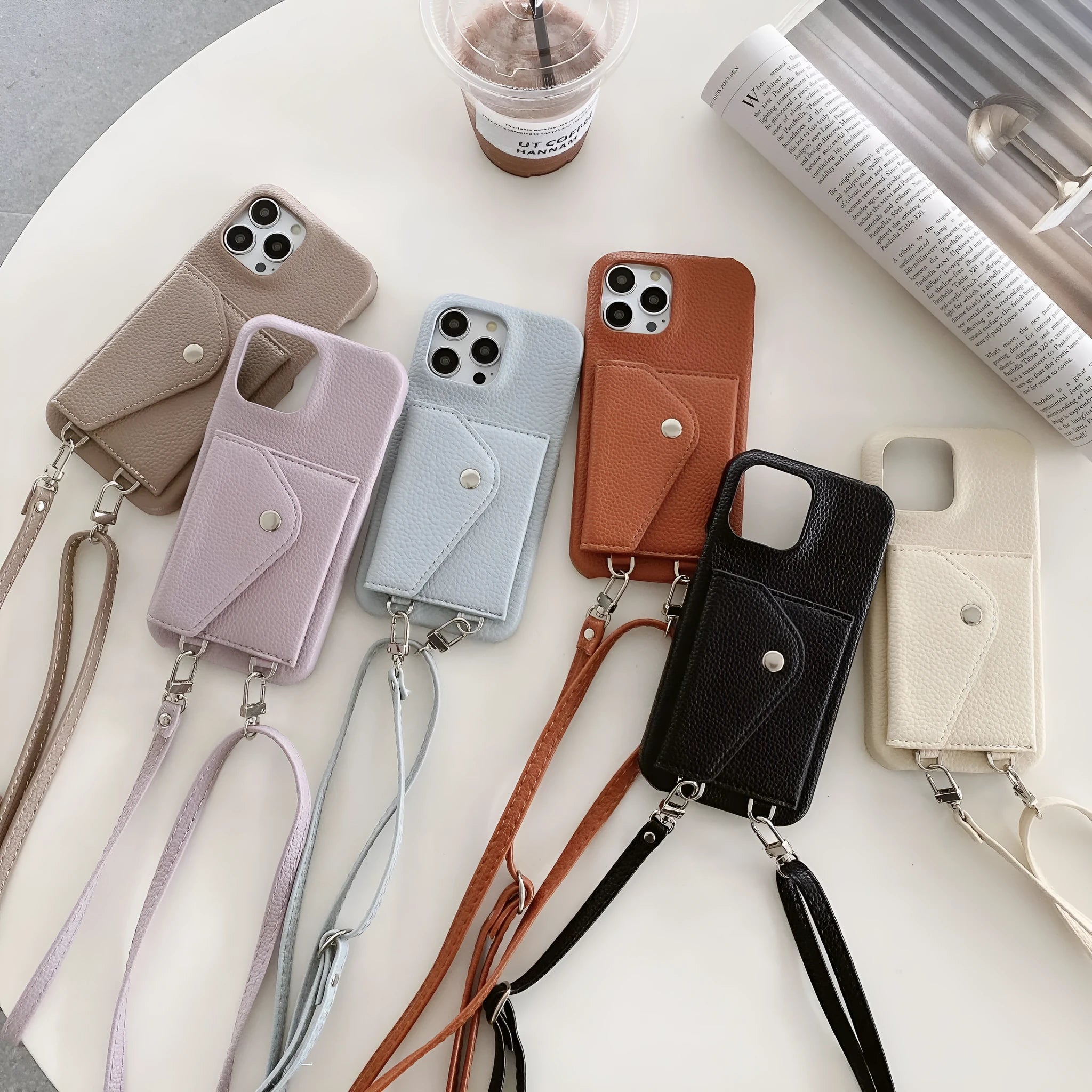 White PC leather card holder crossbody phone case with lychee pattern, triangle veil card slot, and lanyard for iPhone