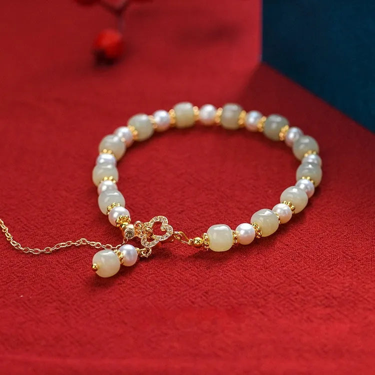Hetian jade bracelet with gold electroplated alloy clasp and round pearl pendant