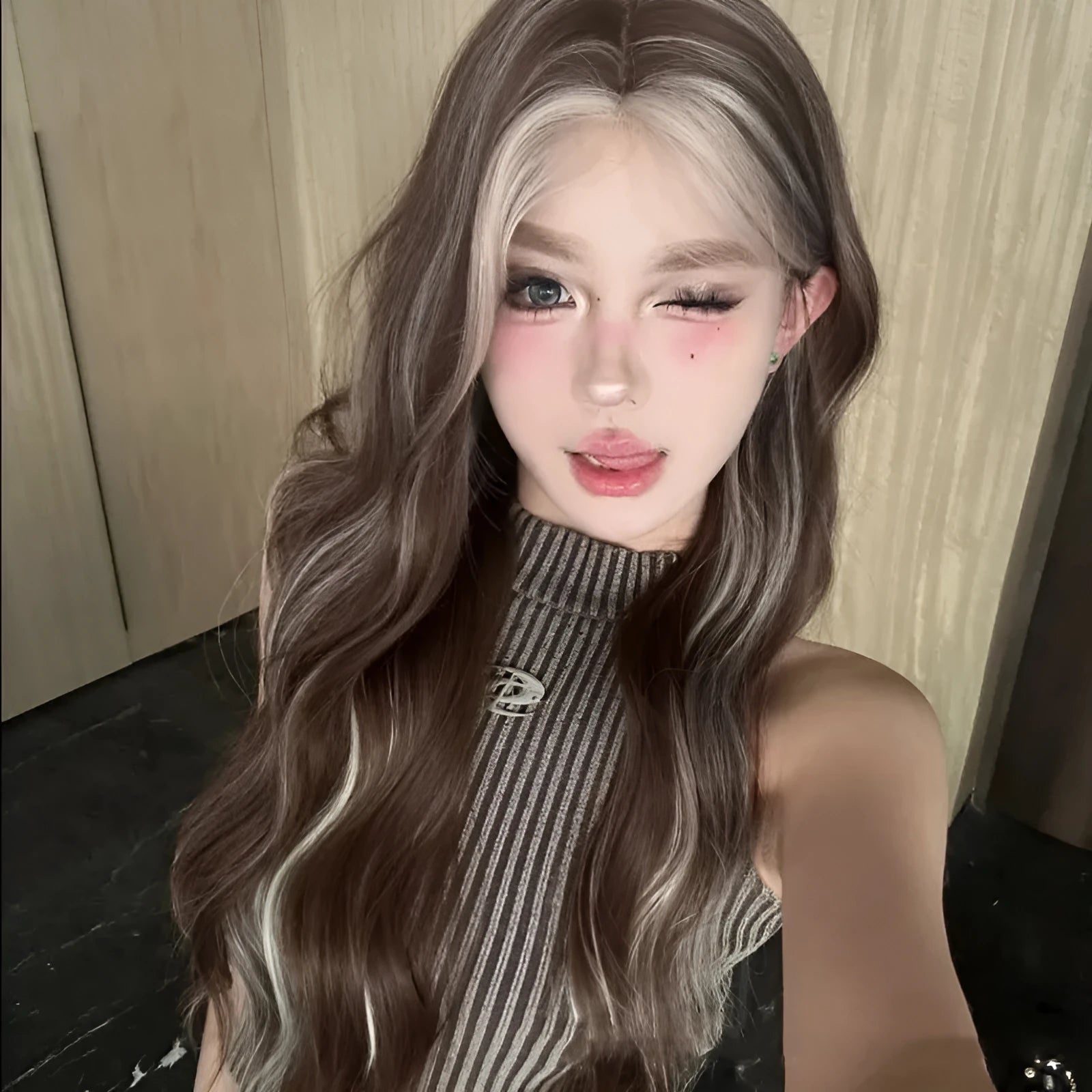 Long curly synthetic wig with grey golden highlights and high temperature fibre construction