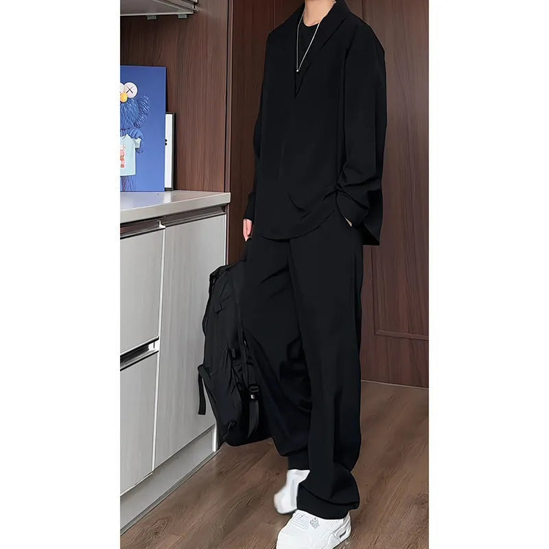 Men's black casual two-piece set with long sleeve polo shirt and matching trousers in slim fit design