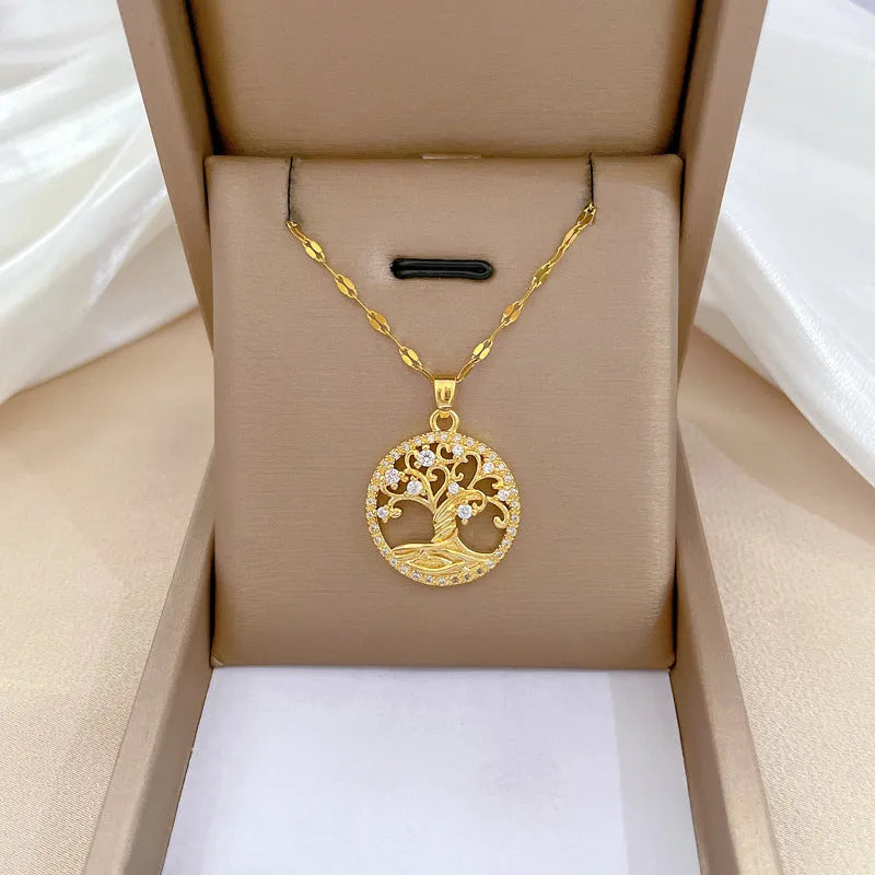 Gold-plated stainless steel necklace with mother-of-pearl and rhinestone pendant on a lip chain.