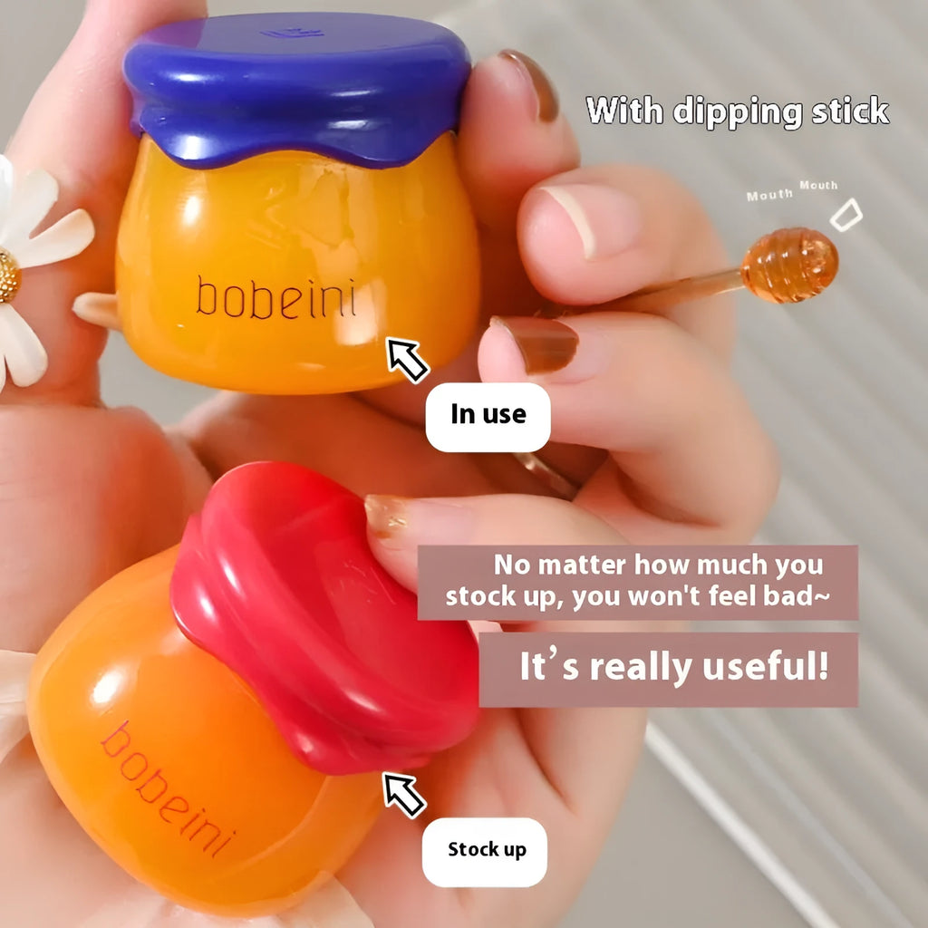 Vaseline lip balm in 9g honey pot with small brush applicator in pomegranate or blueberry flavour