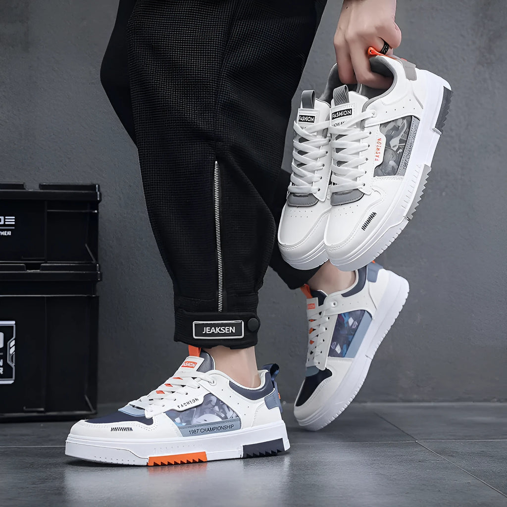 Men's white casual sneakers with lace-up front, low heel, and mesh lining, side view.