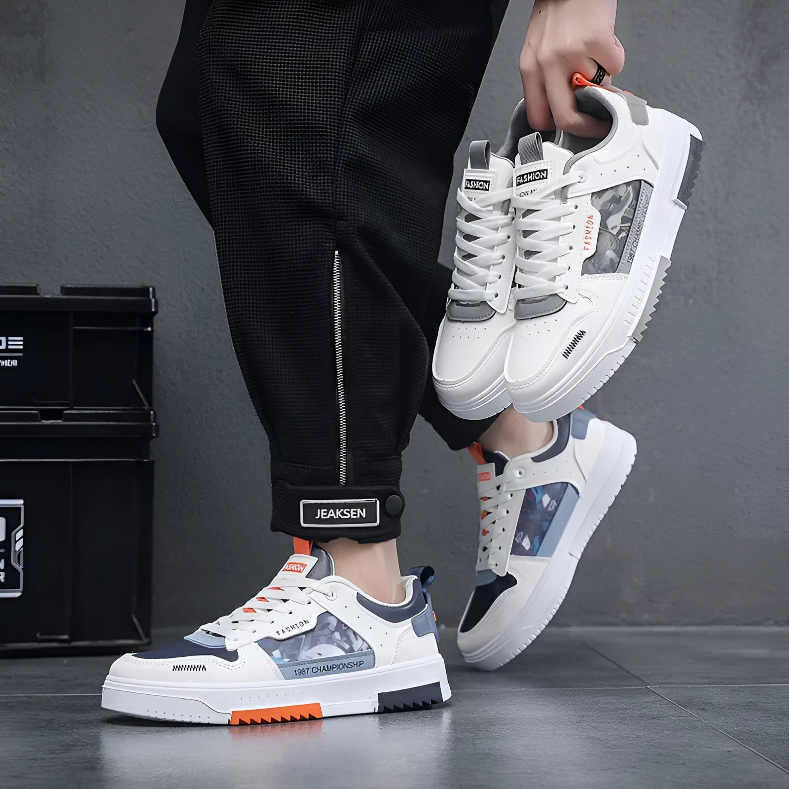 Men's white casual sneakers with lace-up front, low heel, and mesh lining, side view.