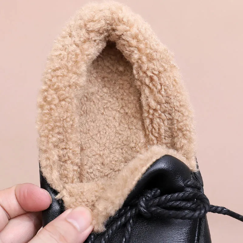 Black flat non-slip slip-on fleece-lined warm shoes with microfiber upper and round toe
