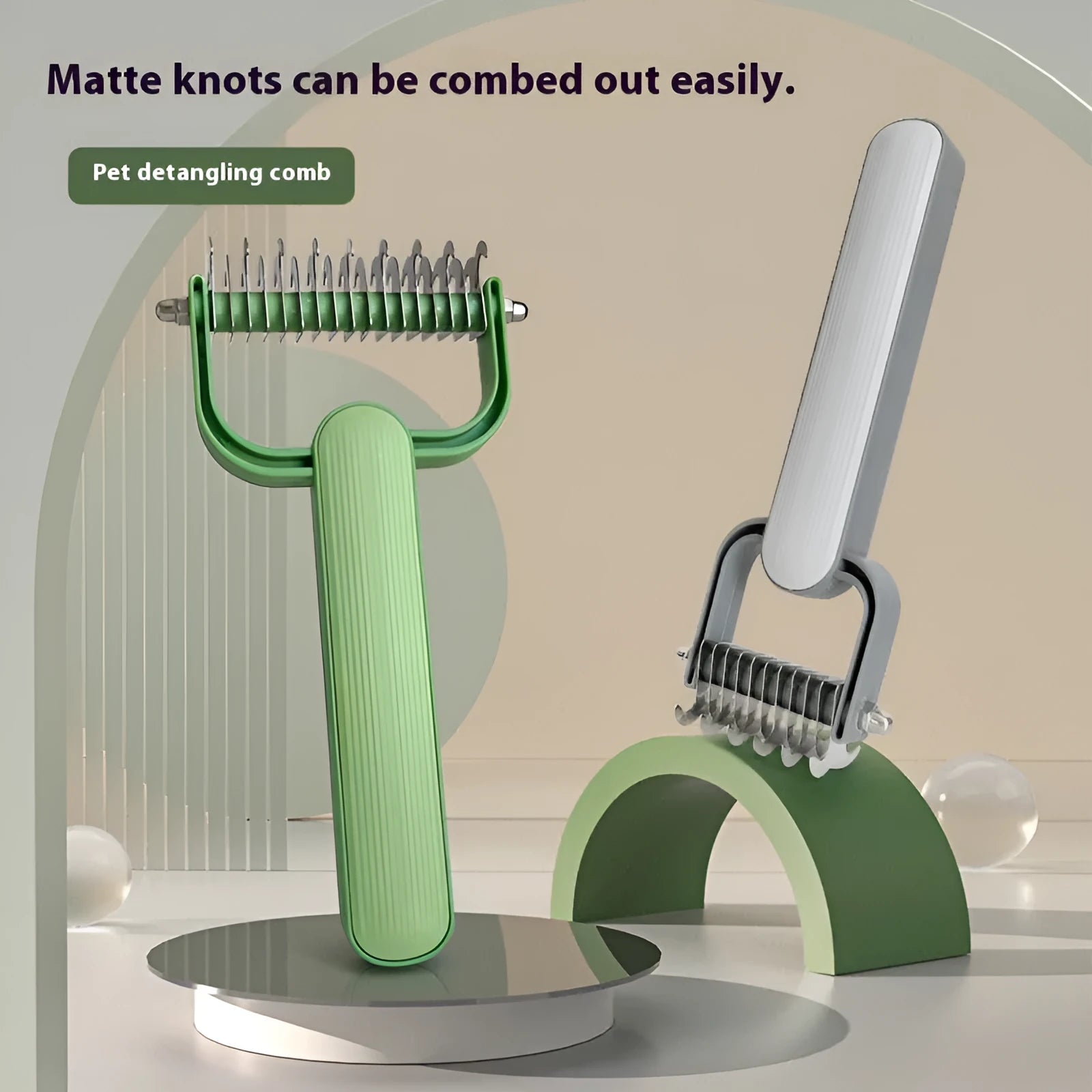 Green and grey pet unknotting comb for dogs with stainless steel teeth on a PP handle.