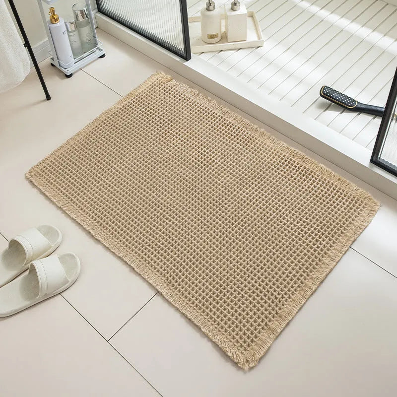 Square checkered pattern non-slip bathroom floor carpet on a tiled floor