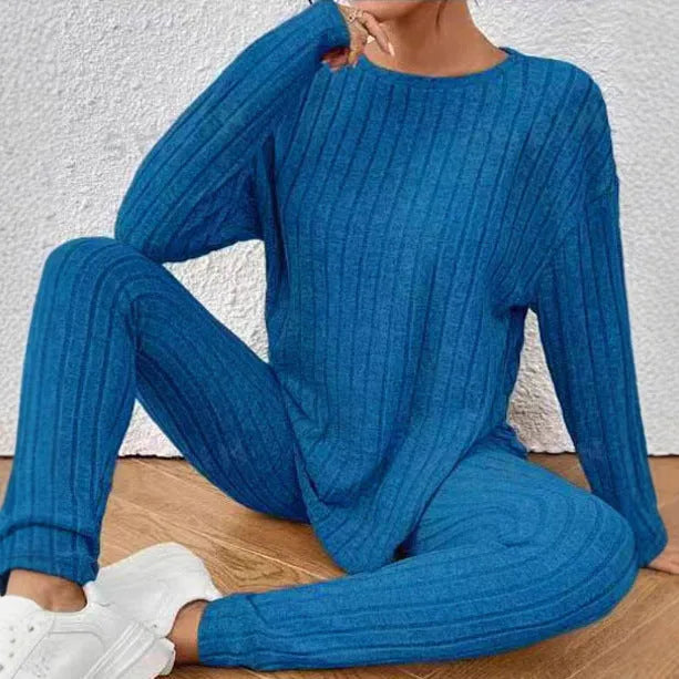 Sunken stripe black polyester two-piece homewear set showing trousers and top on Asian size mannequin