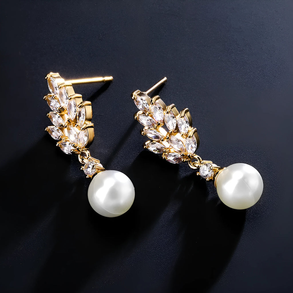 Geometric flower design earrings with micro inlaid zircon and pearl accents in gold, platinum, and rose gold plating.
