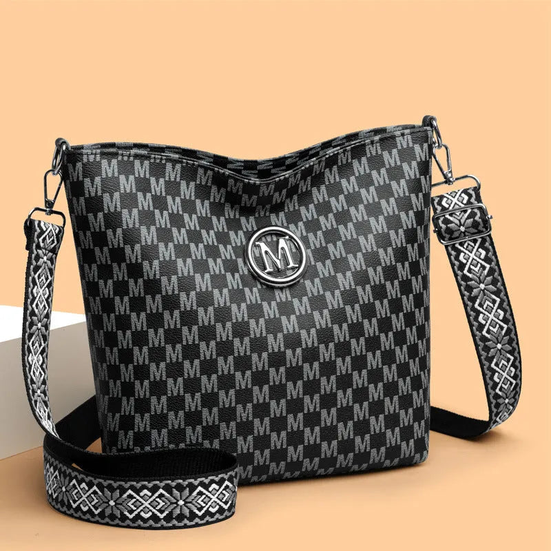 PU leather dumpling shape shoulder bag with sandwich pockets and zippered compartment