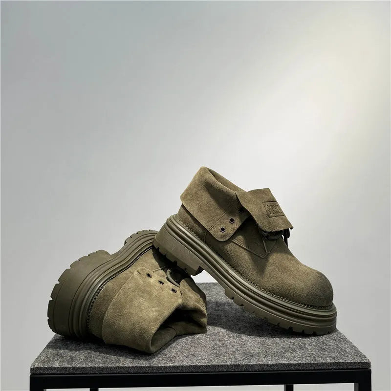 Retro distressed worker style boots in cow suede with thick soles and visible sewing lines