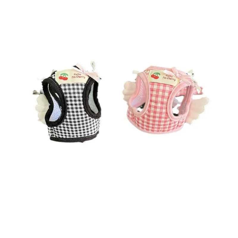 Pink cotton chest and back harness lead for a small dog on a white background.