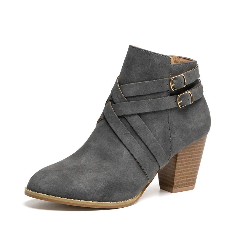 Plus size women's short boots with a 7cm heel in black, featuring a side zip and buckle.