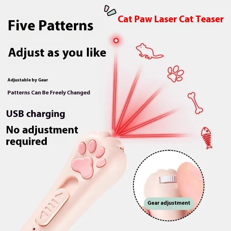 Pink self-playing cat teaser wand toy with USB charging cable on a table.