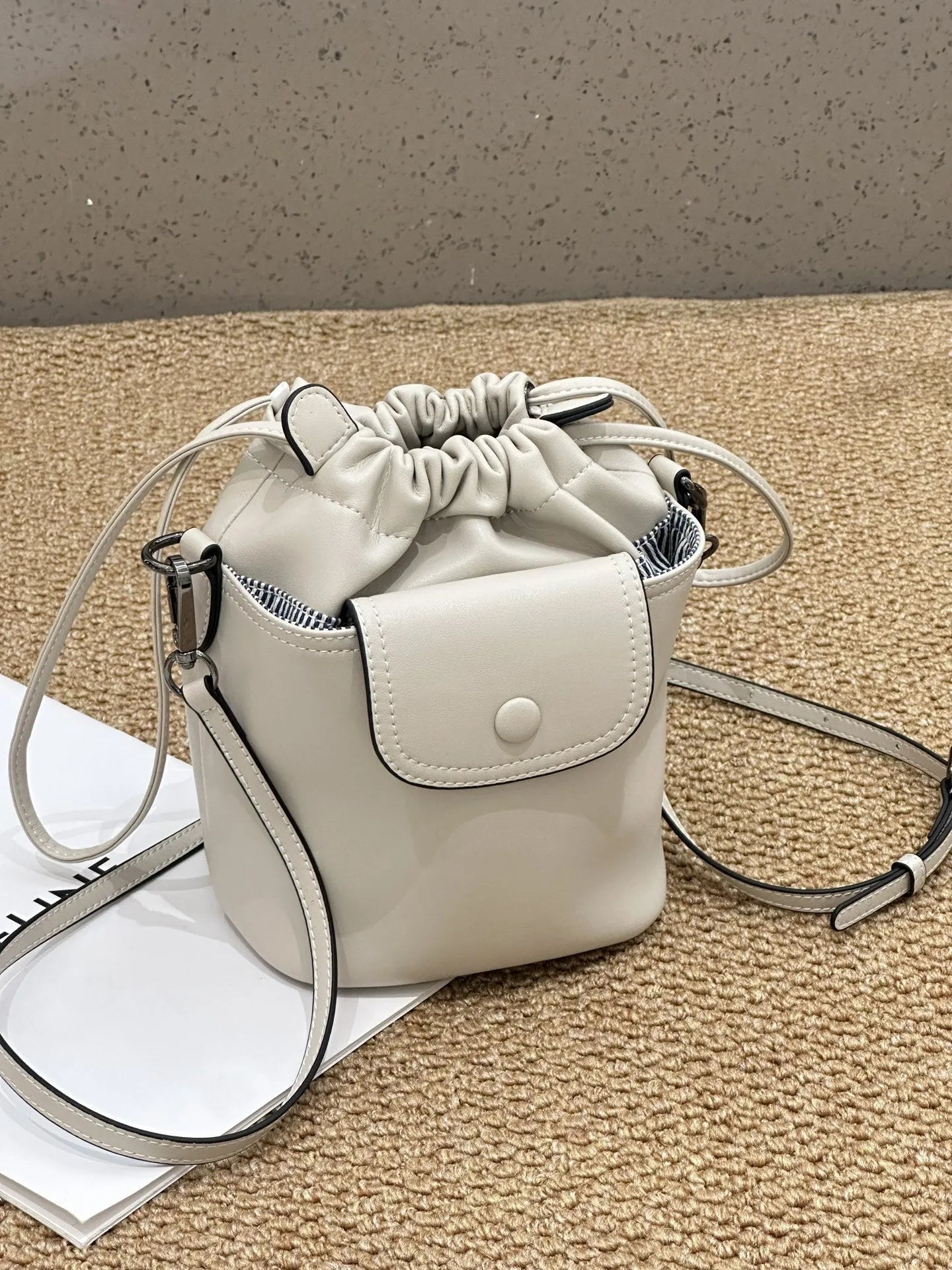 Cortex women's genuine leather drawstring bucket crossbody bag in brown with patchwork design