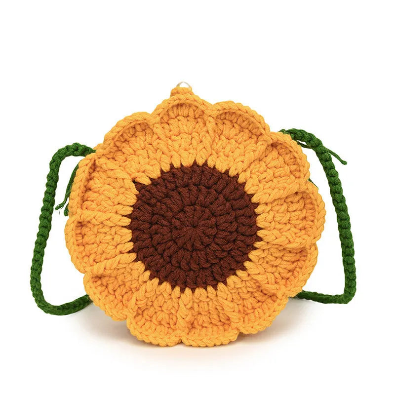 Hand-woven crochet bag with wool flowers in round suitcase shape with cotton lining