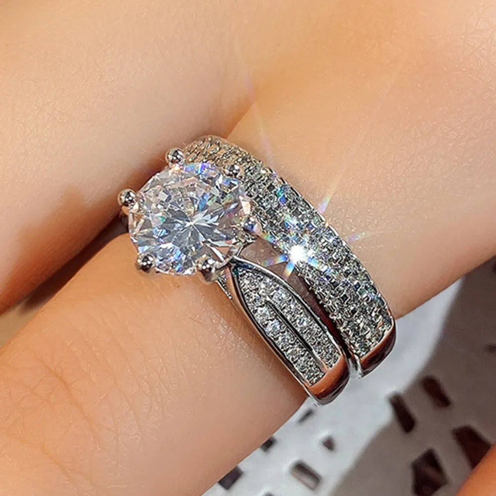 White gold colour alloy wedding bracelet combining a ring and simple bangle.