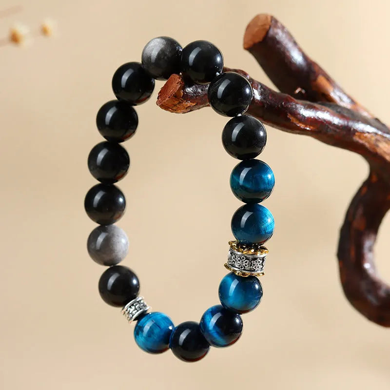 Handmade peacock blue Tigereye bracelet with silver stone accents in geometric ethnic design