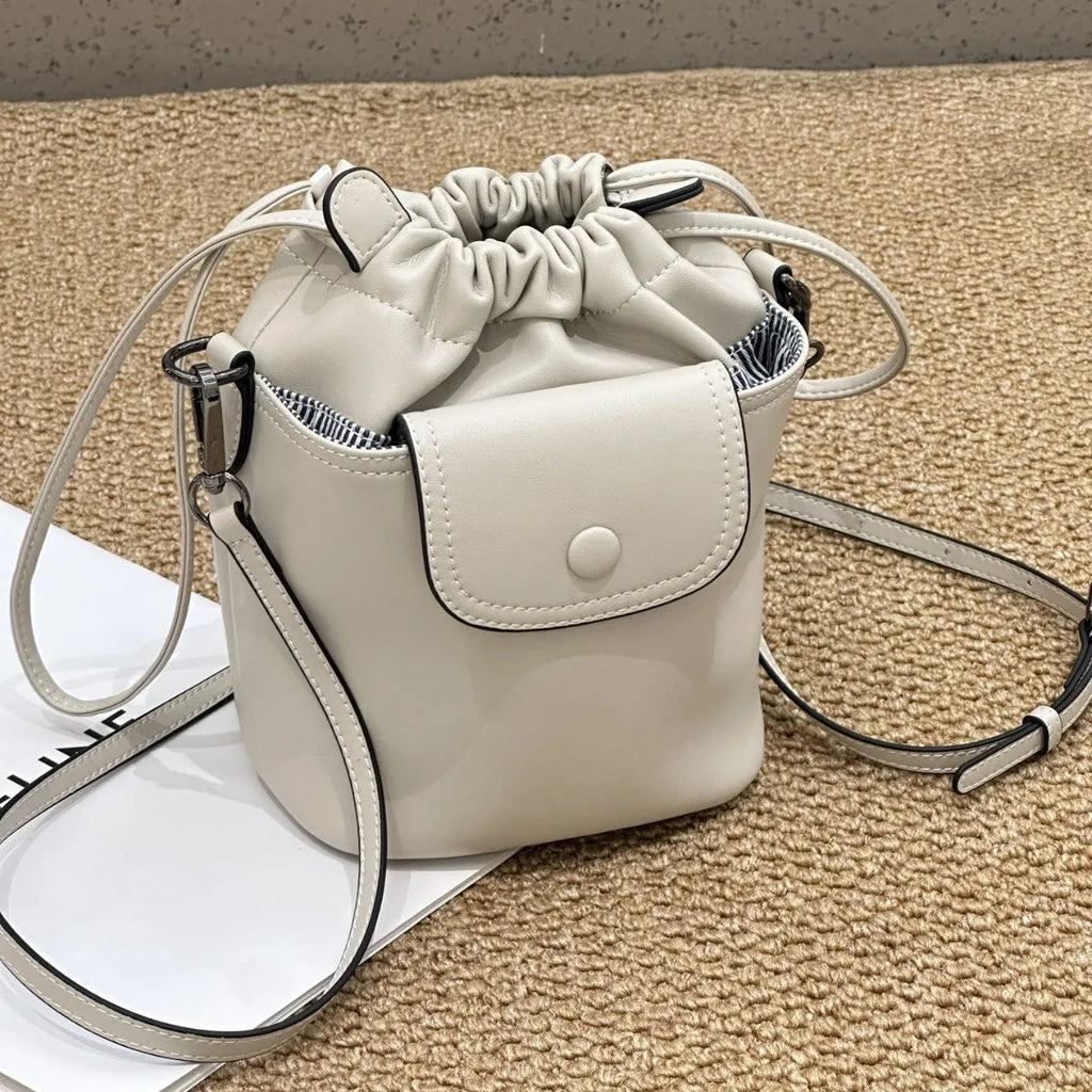 Cortex women's genuine leather drawstring bucket crossbody bag in brown with patchwork design