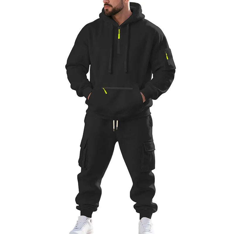Men's loose two-piece hoodie set with fleece-lined hood, zip front, and multi-pocket top in dark gray.