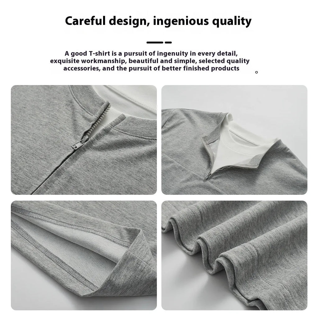 A loose blue cotton blend pullover top with a false zip and patchwork collage stitching detail.