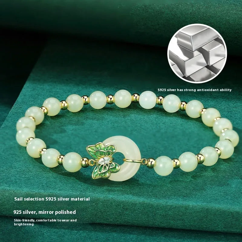 Cyan Hetian Jade bracelet with sterling silver butterfly design, 6mm beads.