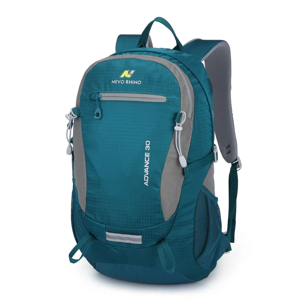 30-litre dark green waterproof mountaineering backpack with airpillow straps on a rocky outdoor trail
