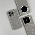 Frosted magnetic hard phone case for IPhone on a table, showing colour options.