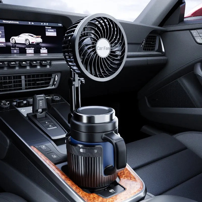 A portable fan with a base designed to fit into a car cup holder, with power cable for 12V, 24V, or USB connection.