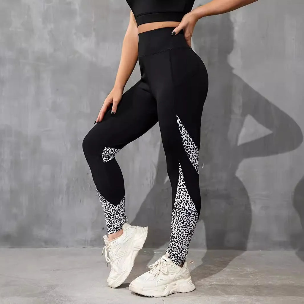 Women's black high-waisted cropped sports leggings with pocket detail and leopard print design