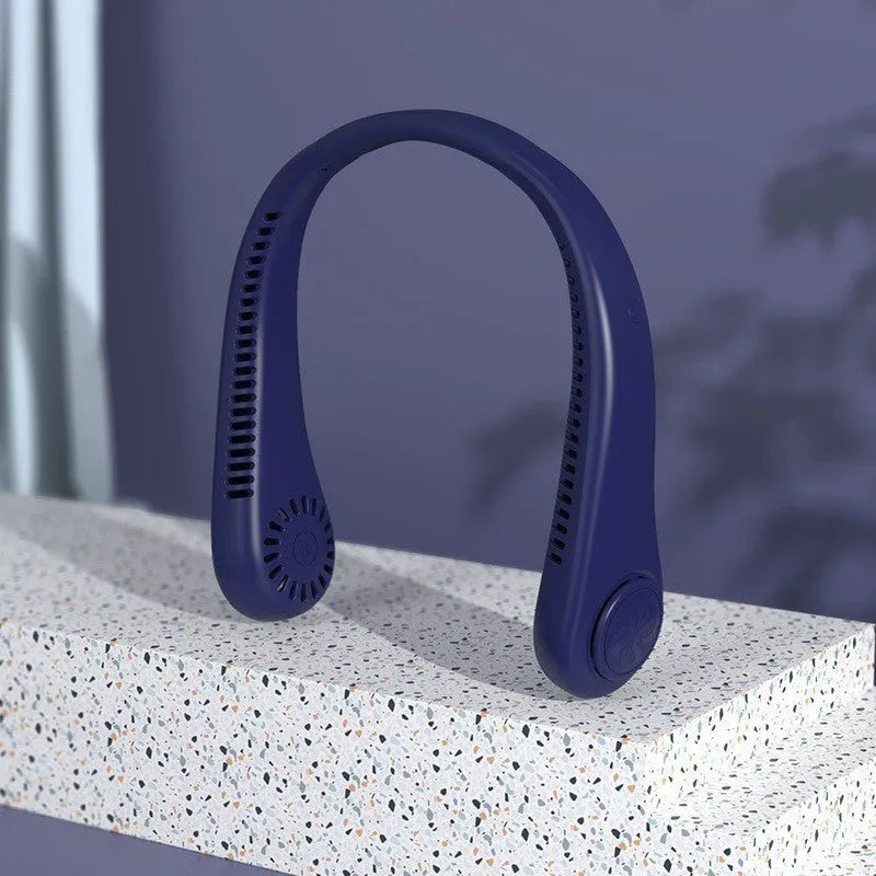 Pink bladeless neck fan being worn, showing USB charging port and control buttons.
