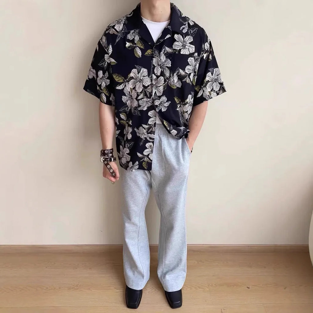 Black men's short-sleeve Cuban collar shirt with floral print, made from ice silk fabric.