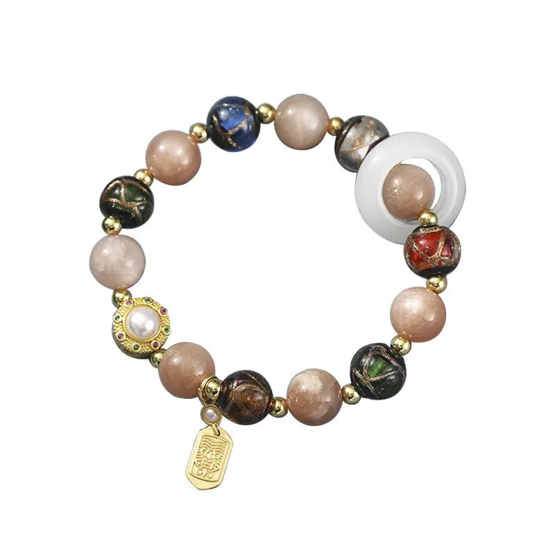 Hand-woven fragrant grey coloured glaze bracelet with sunstone and white lip shell beads