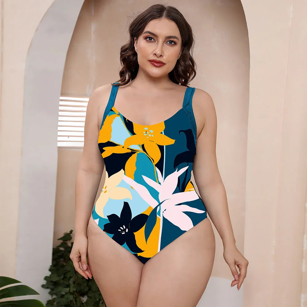 A one-piece conservative vest swimsuit with spaghetti straps in a floral print pattern.