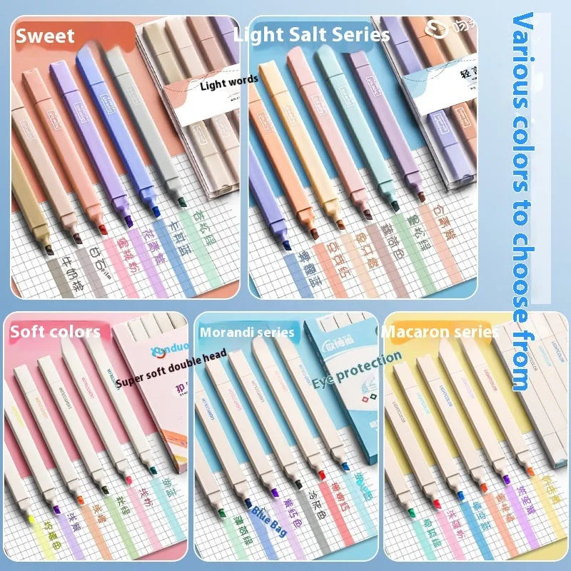 Set of double-ended fluorescent marking pens in assorted bright colours on a white background