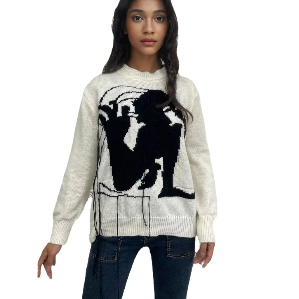 Women's loose grey alpaca wool pullover sweater with tassel detailing and round neck