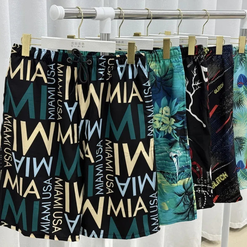 Men's loose fit beach pants in ice silk polyester blend fabric with stripe or floral patterns