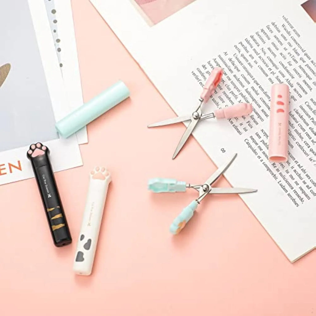 Cat paw mini folding scissors in four colours showing closed safety position and decorative handles