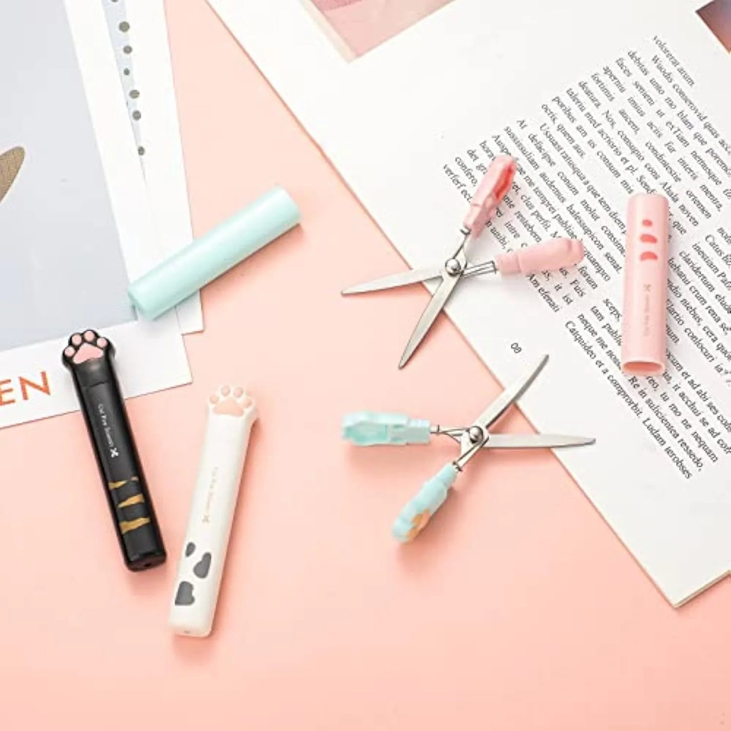 Cat paw mini folding scissors in four colours showing closed safety position and decorative handles