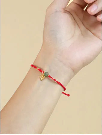 Handmade women's woven bracelet with 925 silver and Hetian jade in red strap option