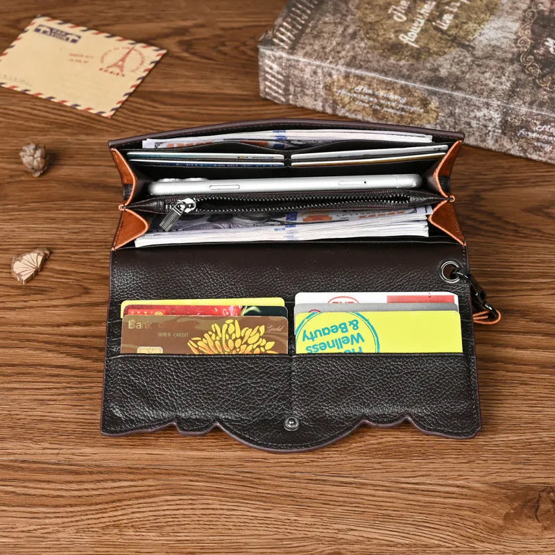 Retro brown Chinese floral embossed tri-fold women's leather wallet open to show compartments.