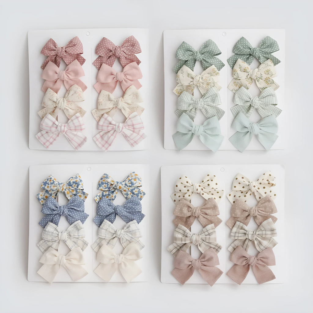 Dovetail bow hairclips for children in multiple colour patterns including beige grid dots and blue flowers