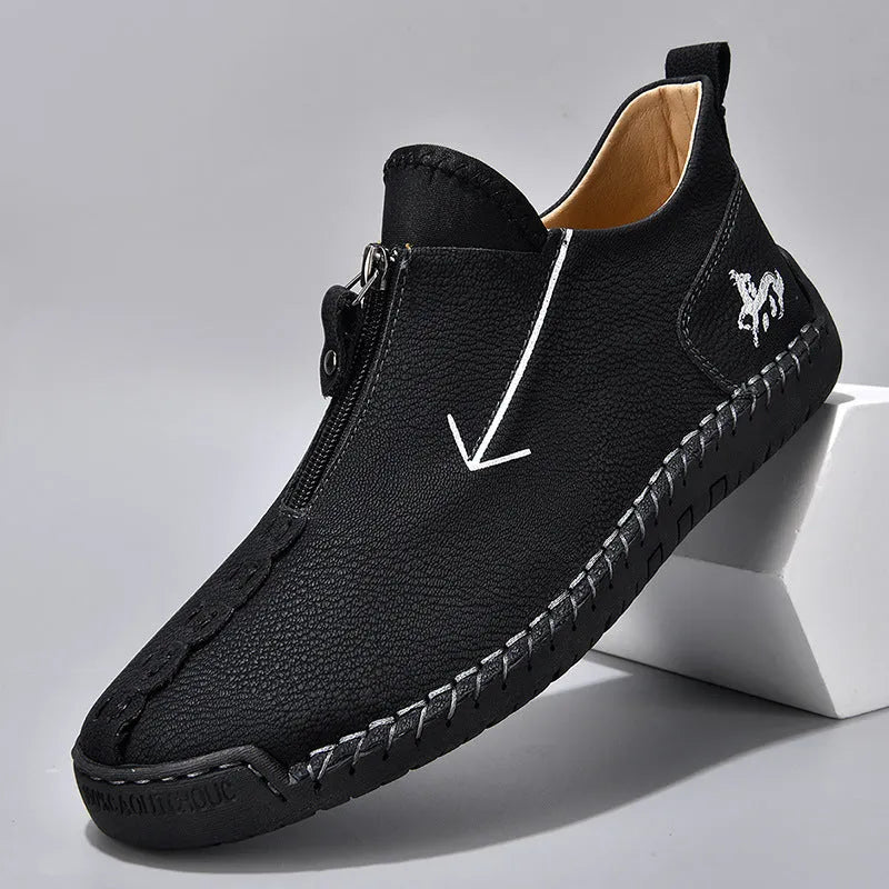 Men's black front zip Martin style boots with round toe and low rubber sole.