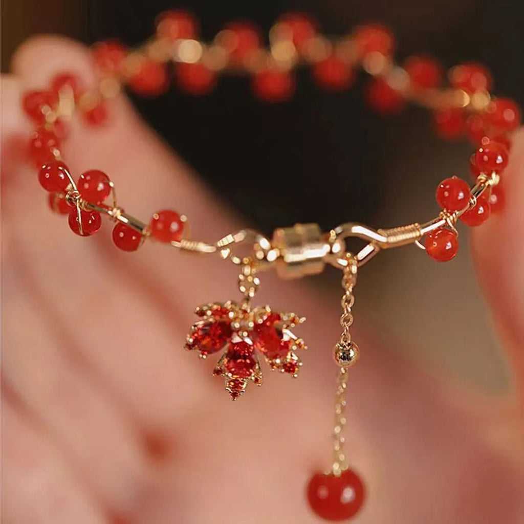 Red Chinese style magnetic bracelet with ginkgo leaf design and electroplated finish