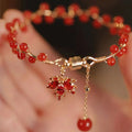 Red Chinese style magnetic bracelet with ginkgo leaf design and electroplated finish