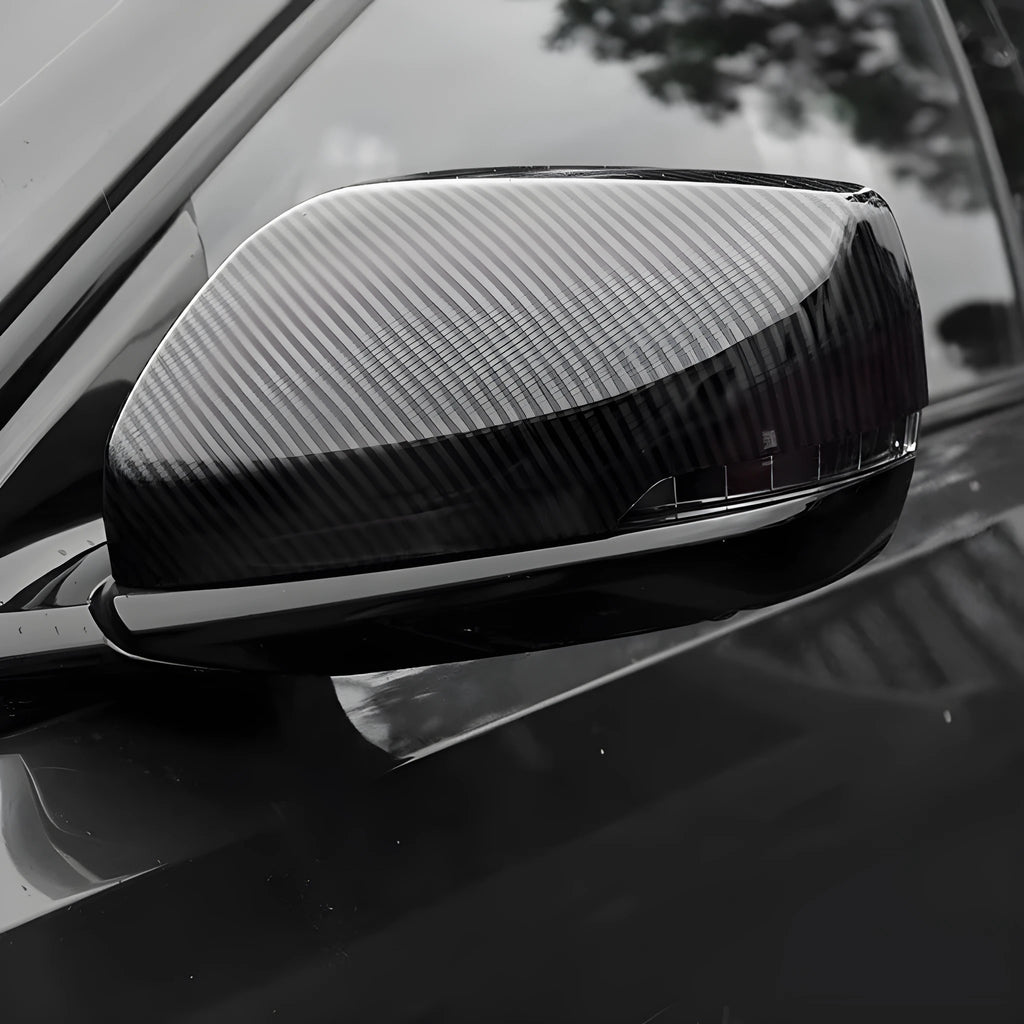 Pair of ABS plastic rearview mirror covers for Cadillac CT5 CT6 in carbon fibre, silver, and rain frame finish options.
